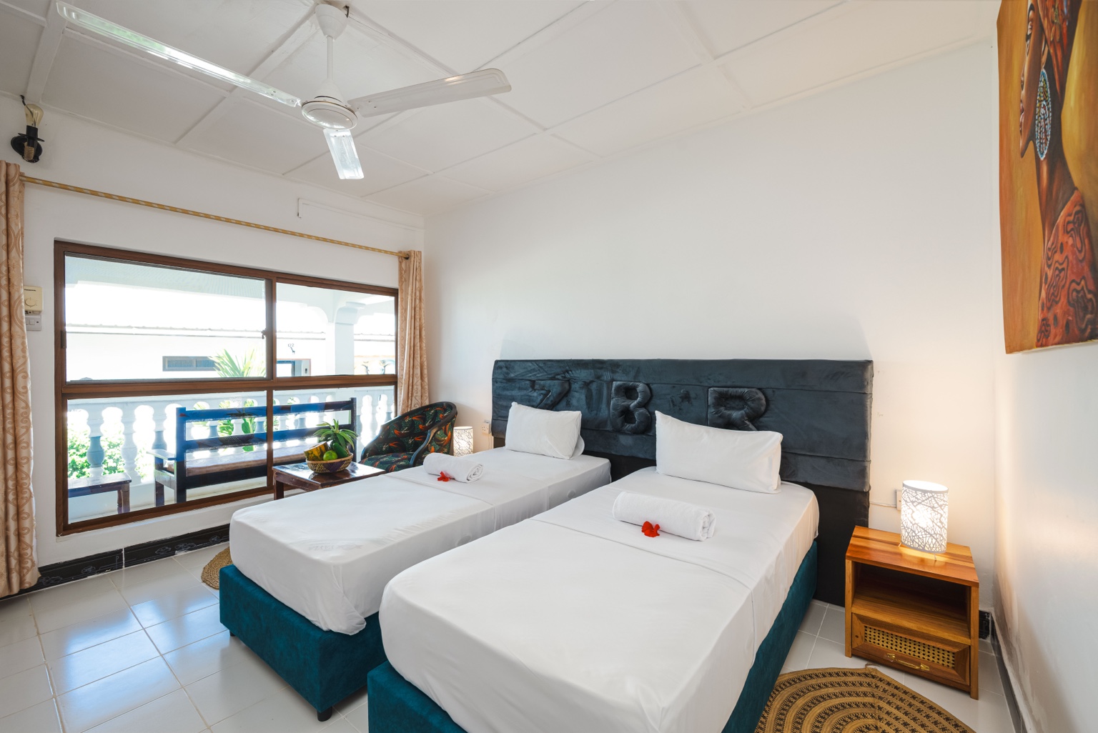 Twin Room — Two single beds beside the large windows